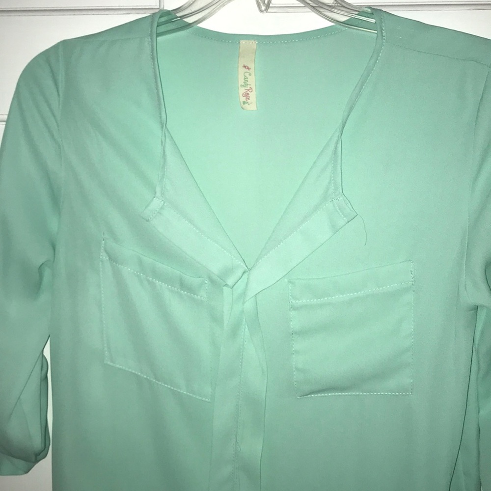Mint green blouse. Size small.